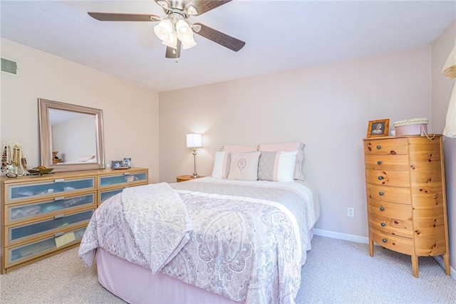 bedroom featuring ceiling fan and light carpet