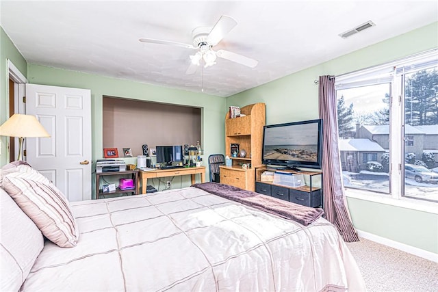 bedroom with ceiling fan and carpet flooring