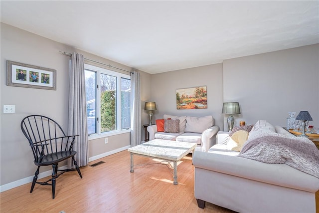 living room with light hardwood / wood-style flooring