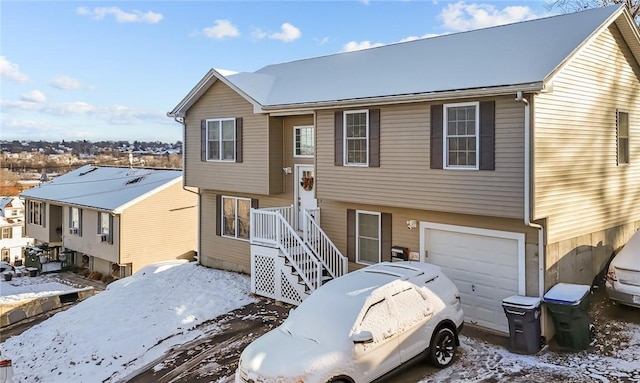 split foyer home featuring a garage