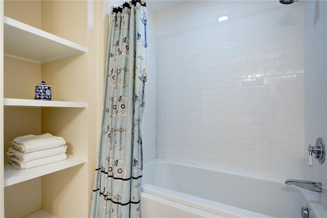 bathroom featuring shower / bathtub combination with curtain