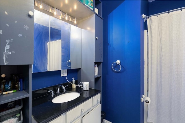 bathroom featuring vanity and walk in shower