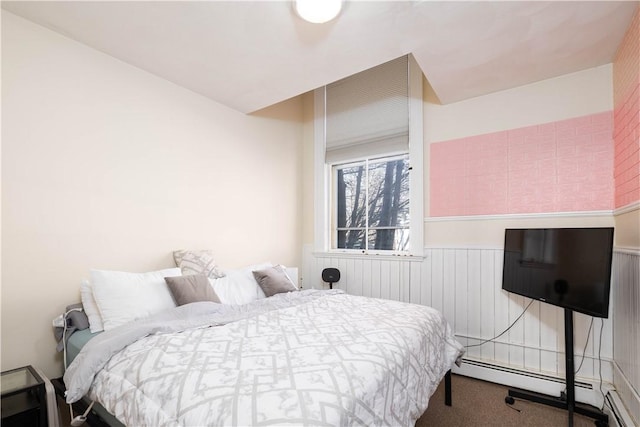 carpeted bedroom featuring a baseboard radiator