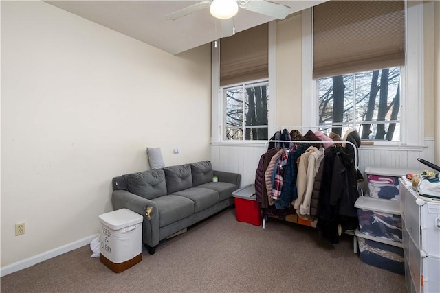 interior space featuring ceiling fan and carpet floors