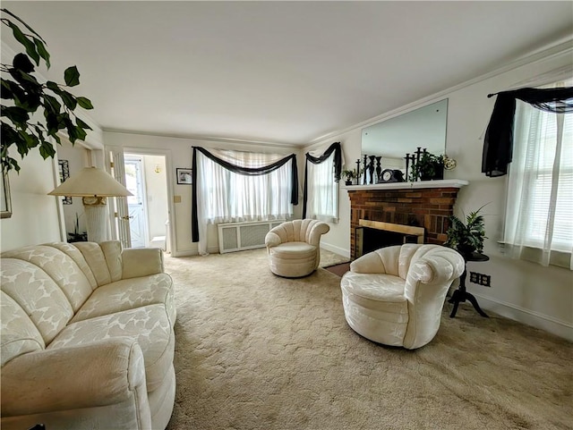 living room with crown molding, a healthy amount of sunlight, and carpet