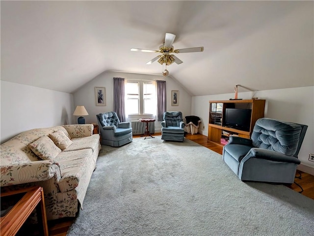 living room with ceiling fan, lofted ceiling, radiator, and hardwood / wood-style floors