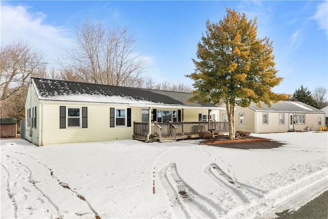 single story home with a wooden deck