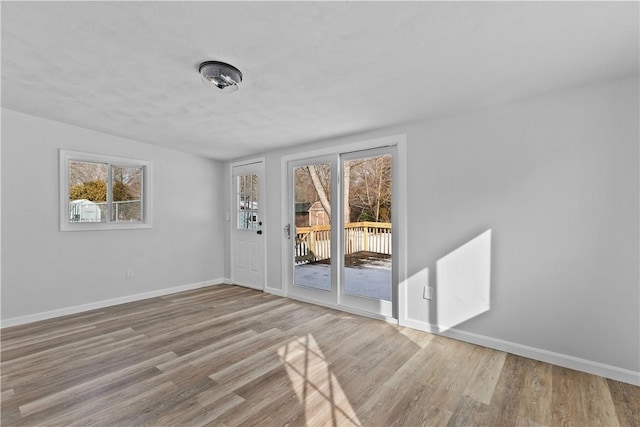 unfurnished room featuring light hardwood / wood-style flooring