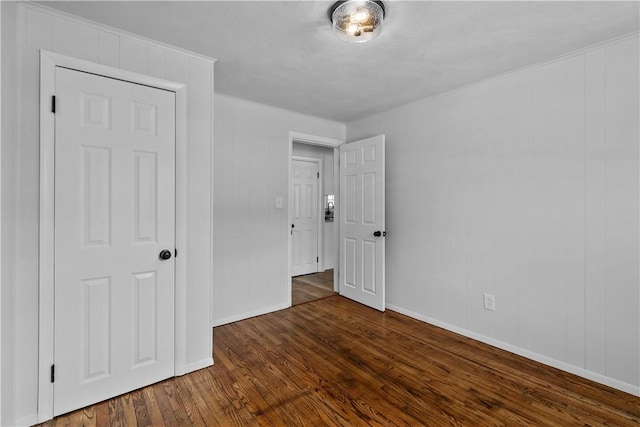 empty room with dark wood-type flooring