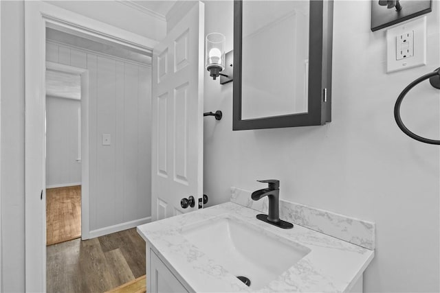 bathroom with hardwood / wood-style flooring and vanity