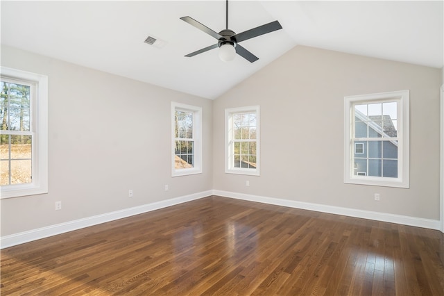 empty room featuring ceiling fan, dark hardwood / wood-style flooring, and vaulted ceiling