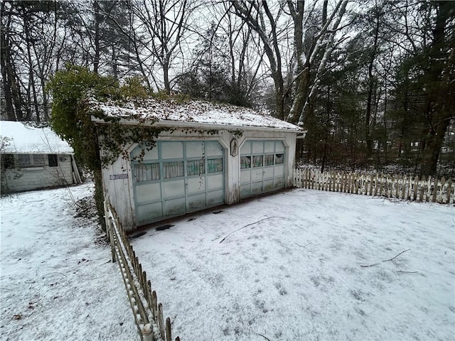 view of snow covered garage