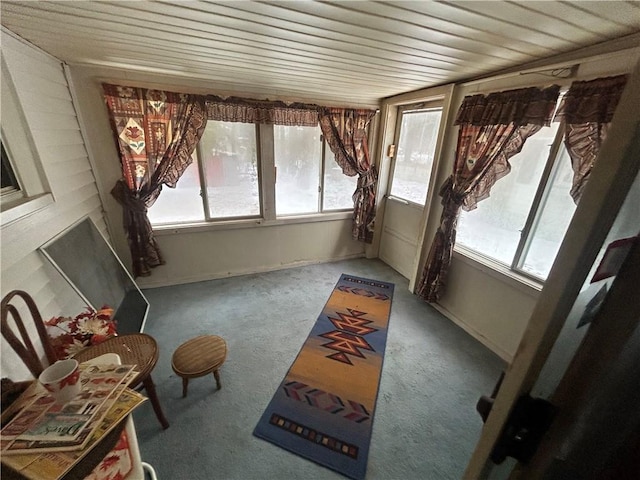 sunroom / solarium with plenty of natural light and wood ceiling