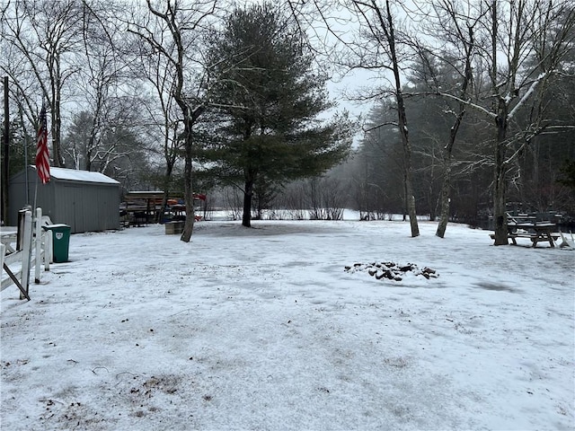 view of yard layered in snow