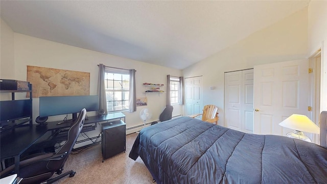 bedroom with multiple closets, light colored carpet, vaulted ceiling, and a baseboard heating unit