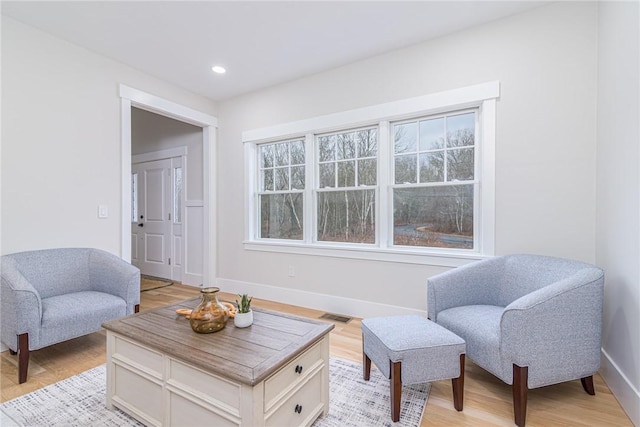 sitting room featuring a wealth of natural light and light wood-type flooring