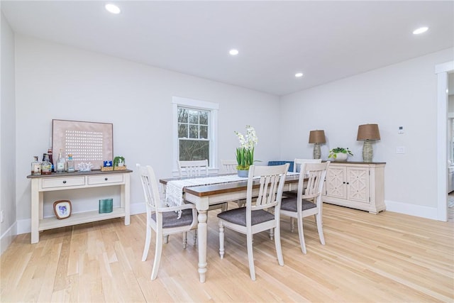 dining area with light hardwood / wood-style flooring