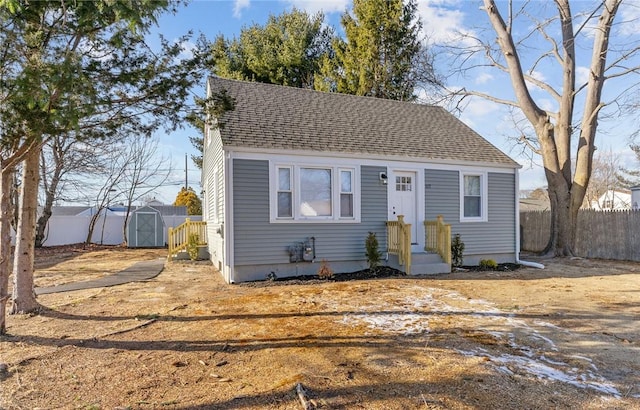 bungalow featuring a storage shed