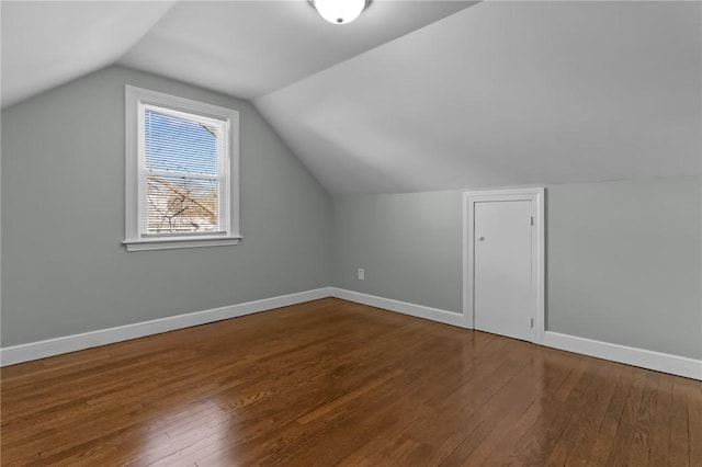 bonus room featuring vaulted ceiling and hardwood / wood-style floors