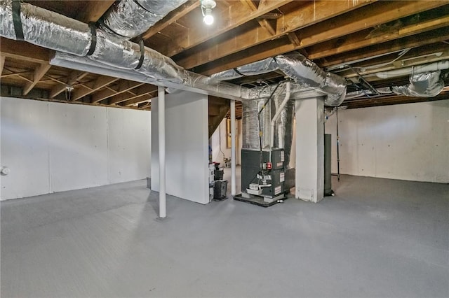 basement featuring heating unit