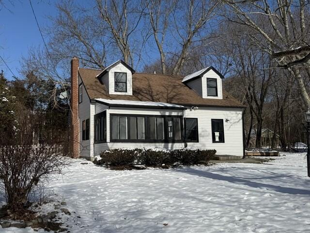 view of new england style home