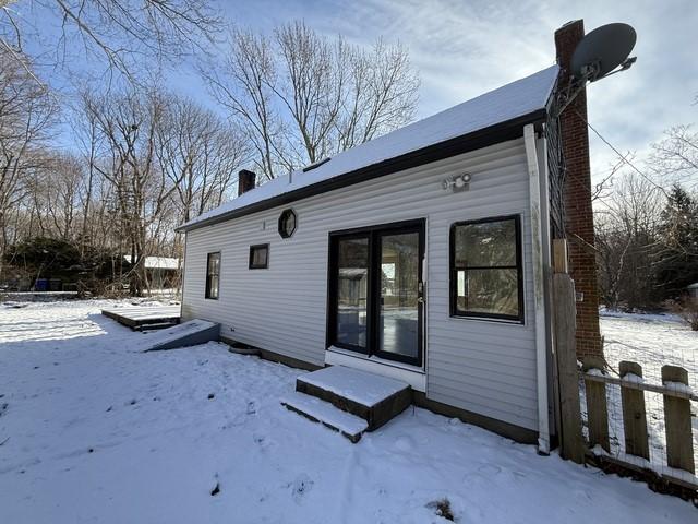 view of snow covered house