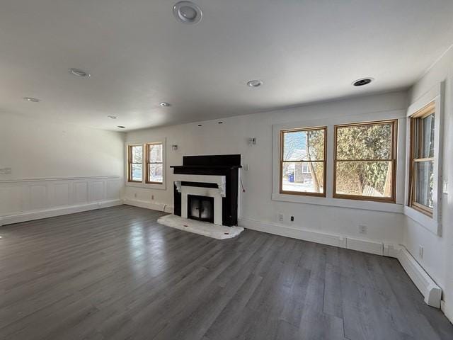 unfurnished living room featuring dark wood-type flooring