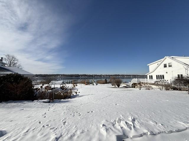 view of yard layered in snow