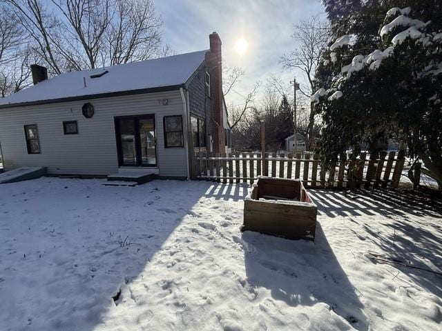 view of snow covered property