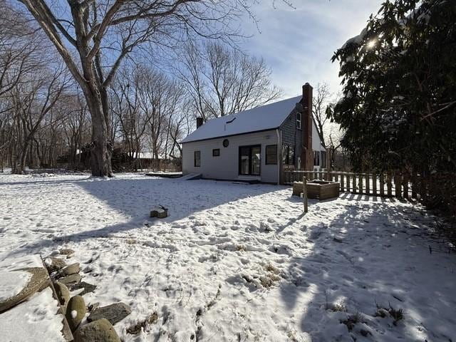 view of snow covered house