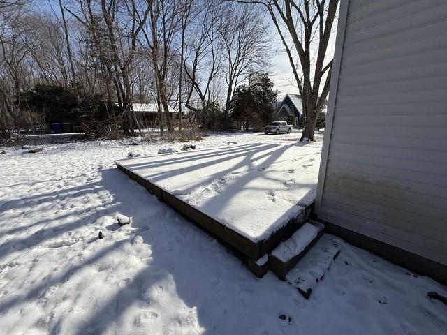 view of yard layered in snow