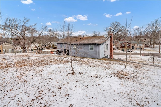 view of snow covered house