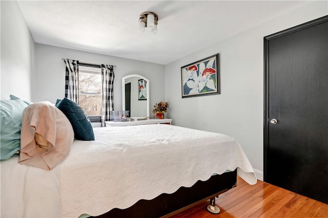 bedroom with hardwood / wood-style floors