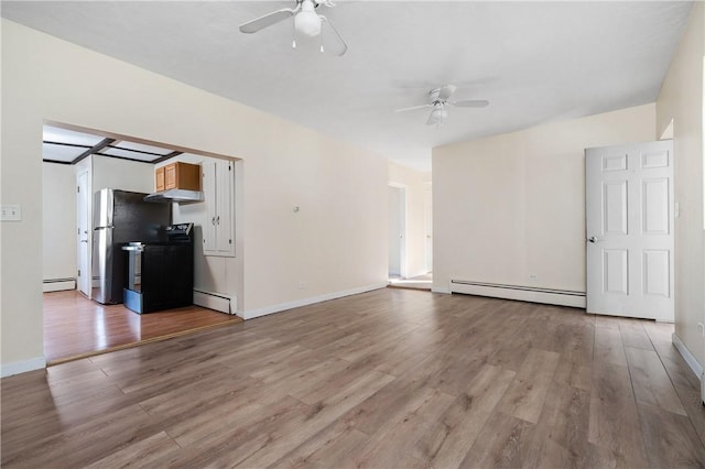 unfurnished living room with baseboard heating, ceiling fan, and light hardwood / wood-style flooring