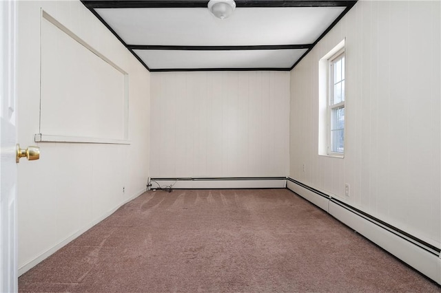 unfurnished room featuring a baseboard heating unit and carpet floors