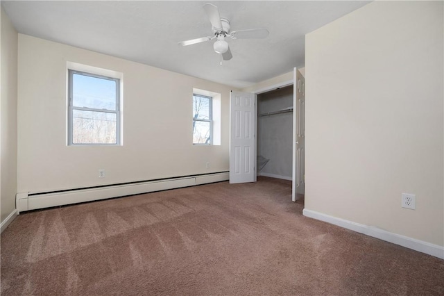 unfurnished bedroom with ceiling fan, a baseboard radiator, a closet, and carpet