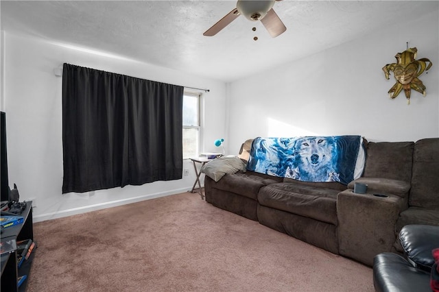 living room featuring ceiling fan and carpet