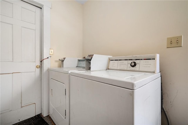 laundry room featuring separate washer and dryer