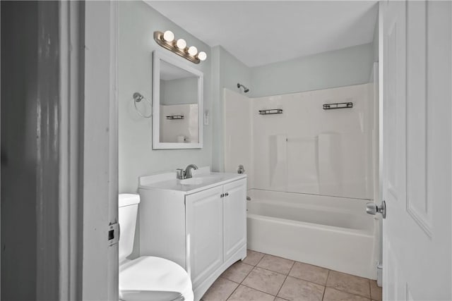 full bathroom with tile patterned flooring, vanity, washtub / shower combination, and toilet