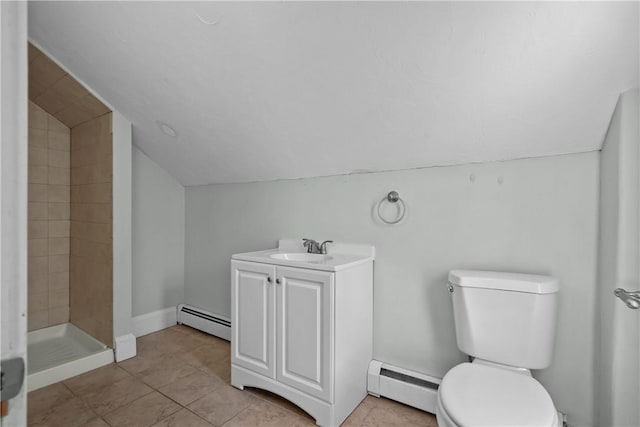 bathroom featuring a baseboard radiator, tiled shower, vanity, and toilet