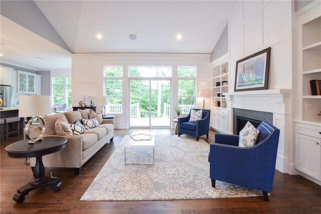 00 Tipping Rock Dr, East Greenwich, RI 02818 - living room featuring vaulted ceiling, dark wood-type flooring, and built in features