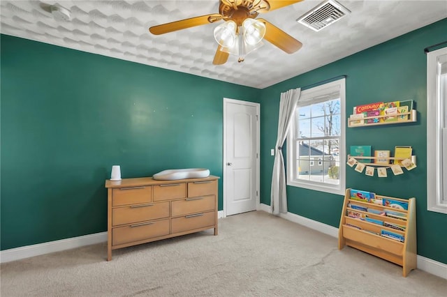 carpeted bedroom featuring ceiling fan