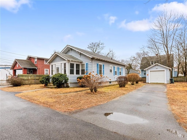 view of front of house featuring a garage and an outdoor structure