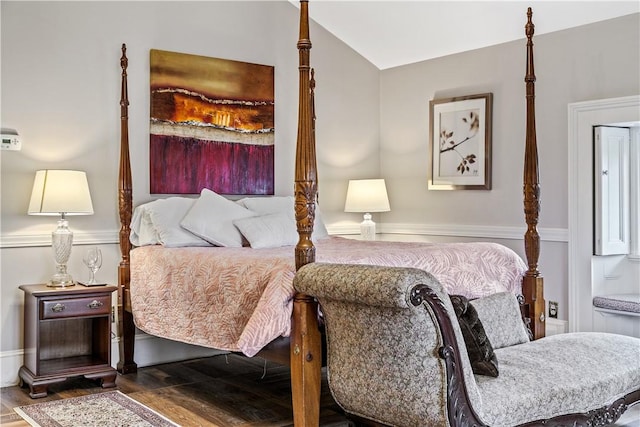 bedroom featuring hardwood / wood-style flooring and vaulted ceiling