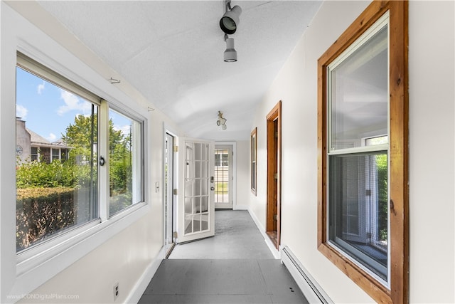 hall featuring a textured ceiling