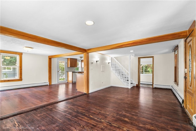 unfurnished living room featuring a baseboard radiator, plenty of natural light, dark wood-type flooring, and beam ceiling