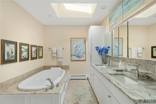 bathroom featuring a tub, vanity, a skylight, and a baseboard heating unit