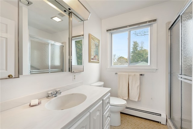 bathroom featuring vanity, a baseboard heating unit, a wealth of natural light, and a shower with door