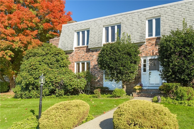 view of front of home with a front yard