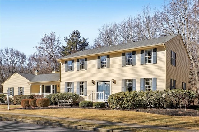 colonial home with a front yard